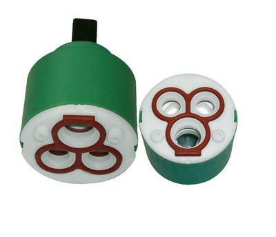 Cartouche en céramique verte pour robinet mitigeur Remer/Mariani, diamètre 40 mm, composants internes blancs et rouges visibles.