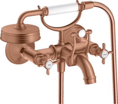 Robinet mitigeur de douche/baignoire AXOR Montreux rouge or brossé avec deux poignées et pommeau de douche effet pluie.